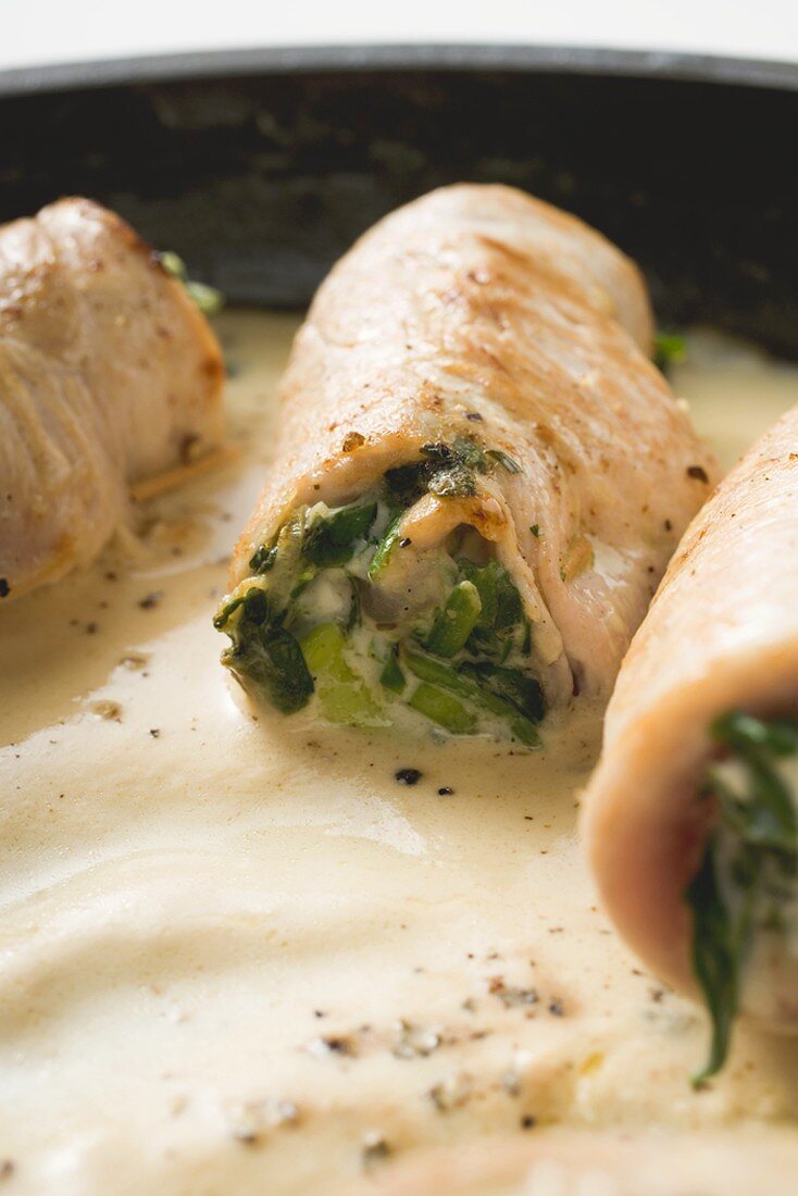 Veal rolls with spinach stuffing in cream sauce