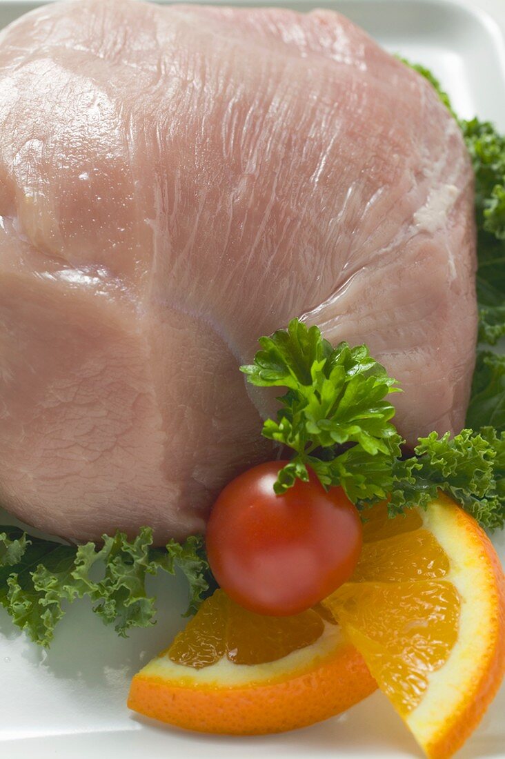 Fresh pork with garnish (close-up)