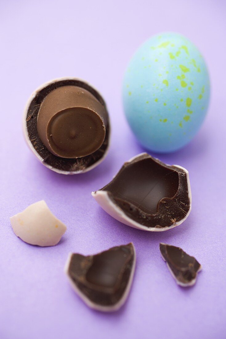 Two chocolate eggs, one broken