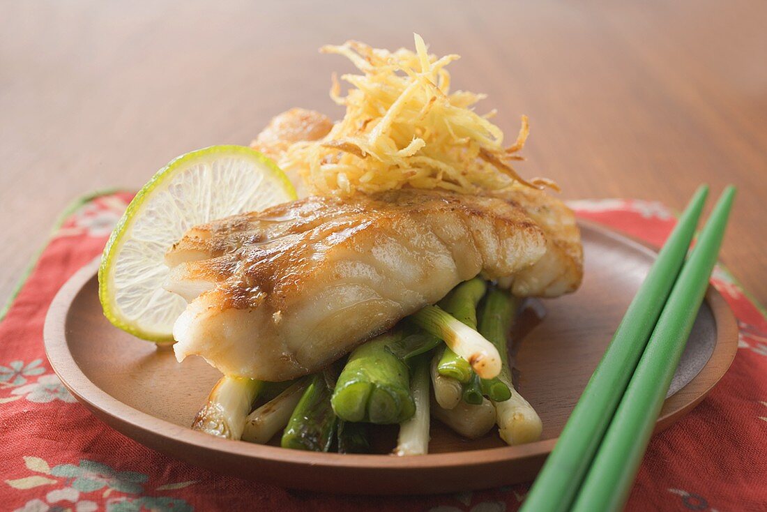 Fish fillet with spring onions and lime