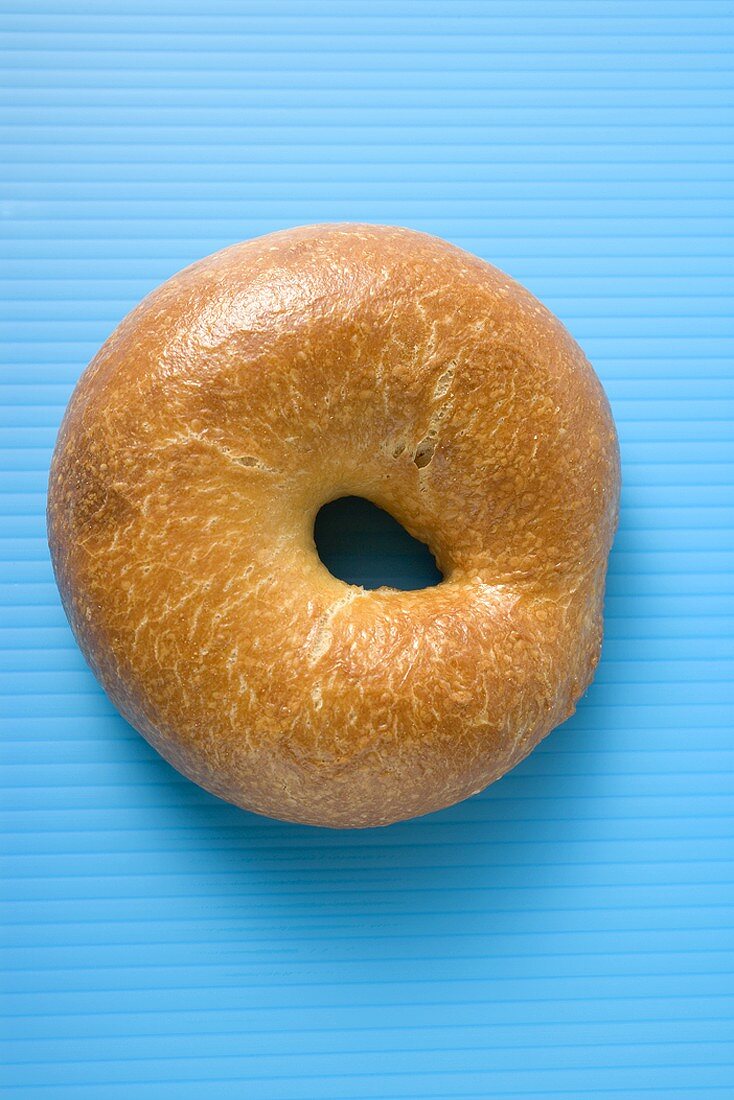 Bagel on blue background