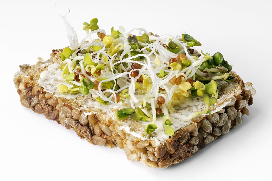 Radish sprouts on buttered whole-grain bread