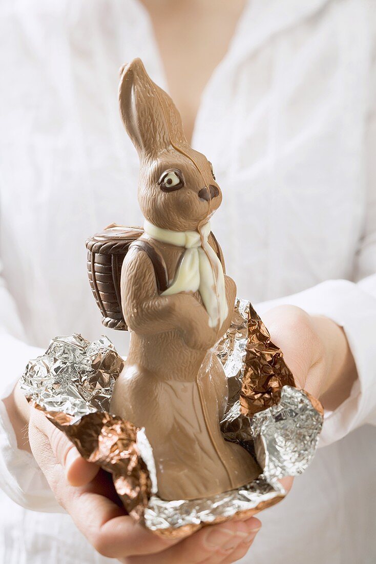 Woman holding chocolate Easter Bunny