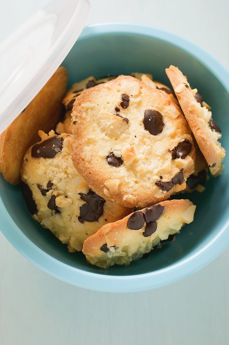 Chocolate chip peanut cookies in blue bowl