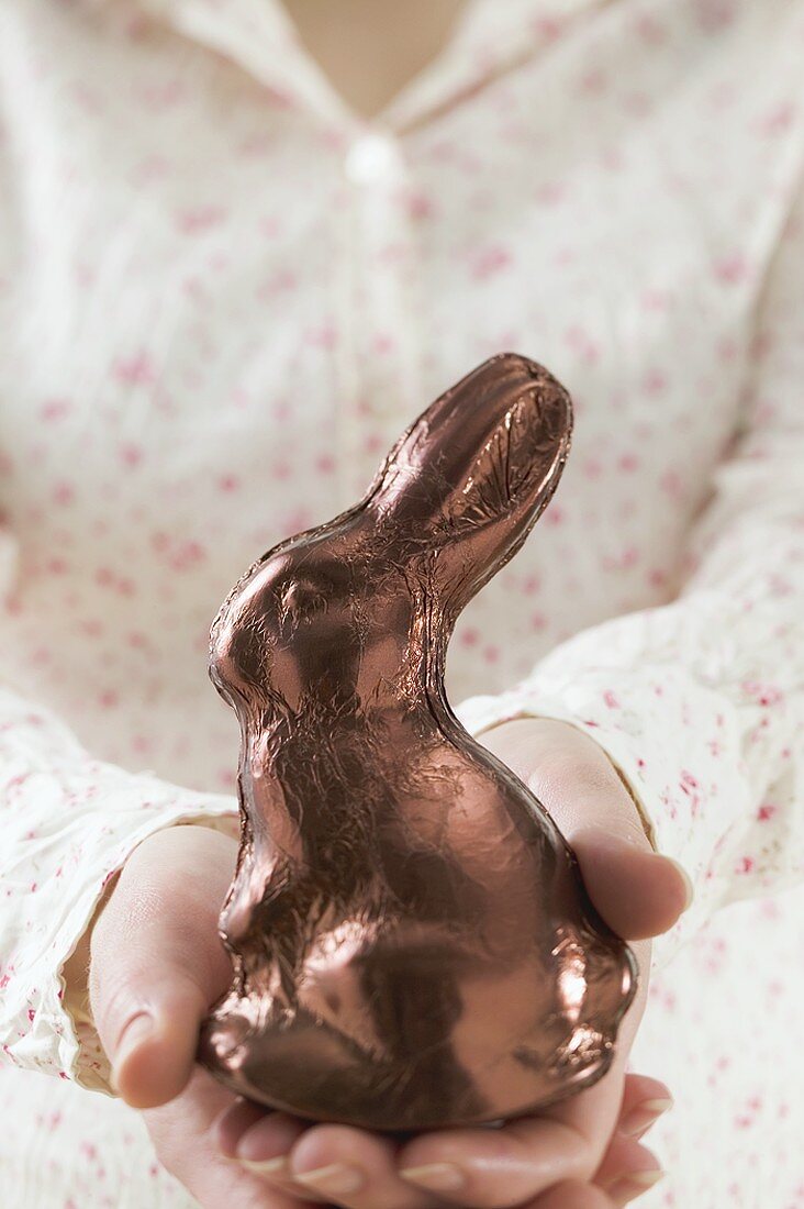 Hands holding Easter Bunny in foil