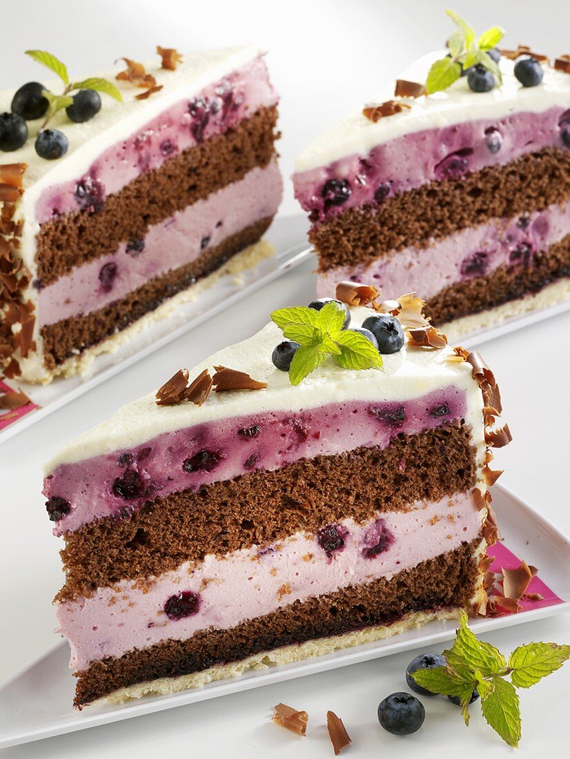 Three pieces of chocolate blueberry cake