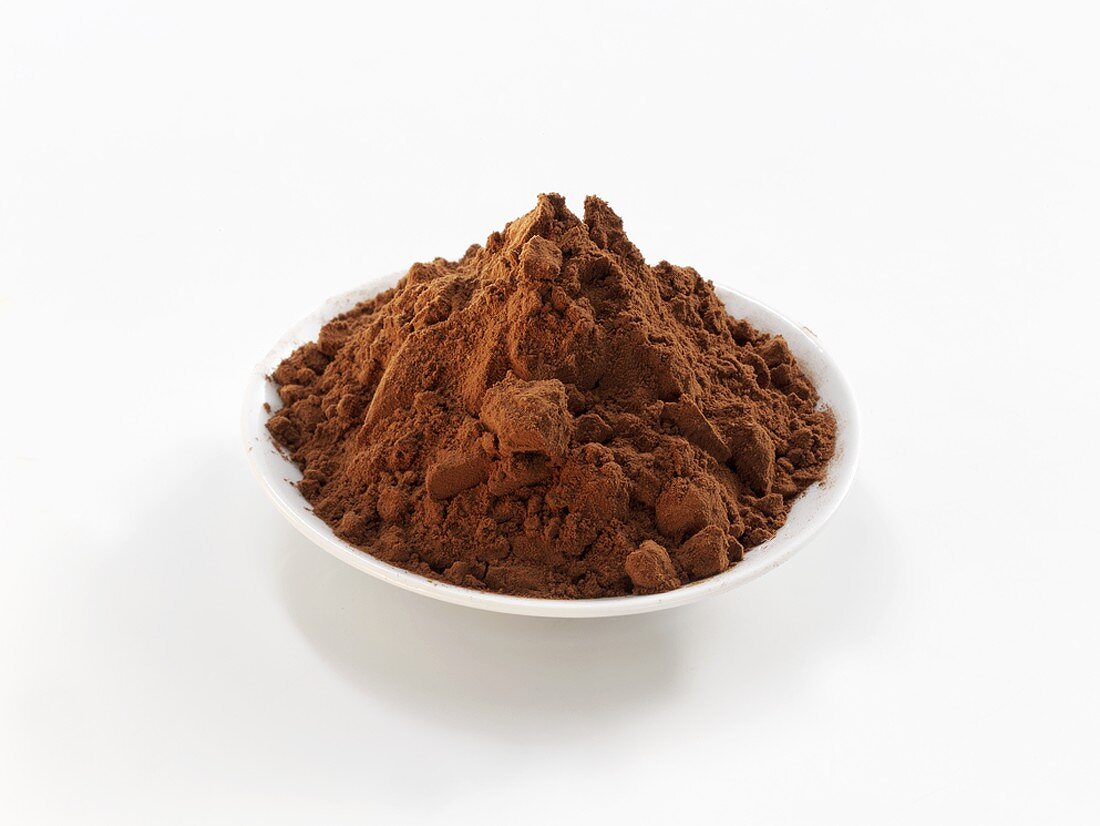 Cocoa powder in white bowl