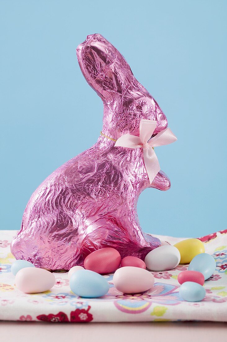 Easter Bunny and sugar eggs on coloured cloth