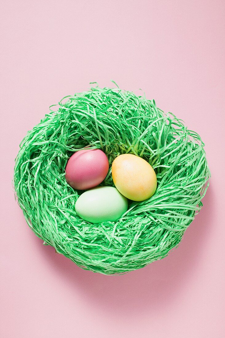 Three sugar eggs in Easter nest