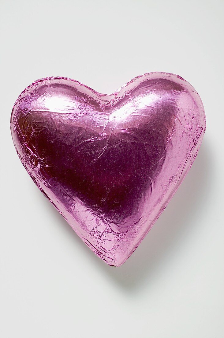 Chocolate heart in pink foil