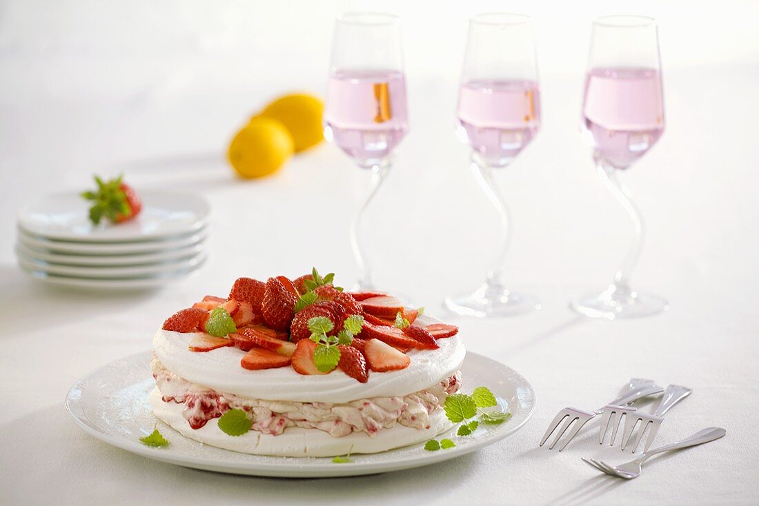 Meringue cake with strawberry cream and fresh strawberries