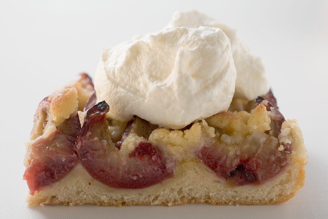 Piece of plum cake with cream