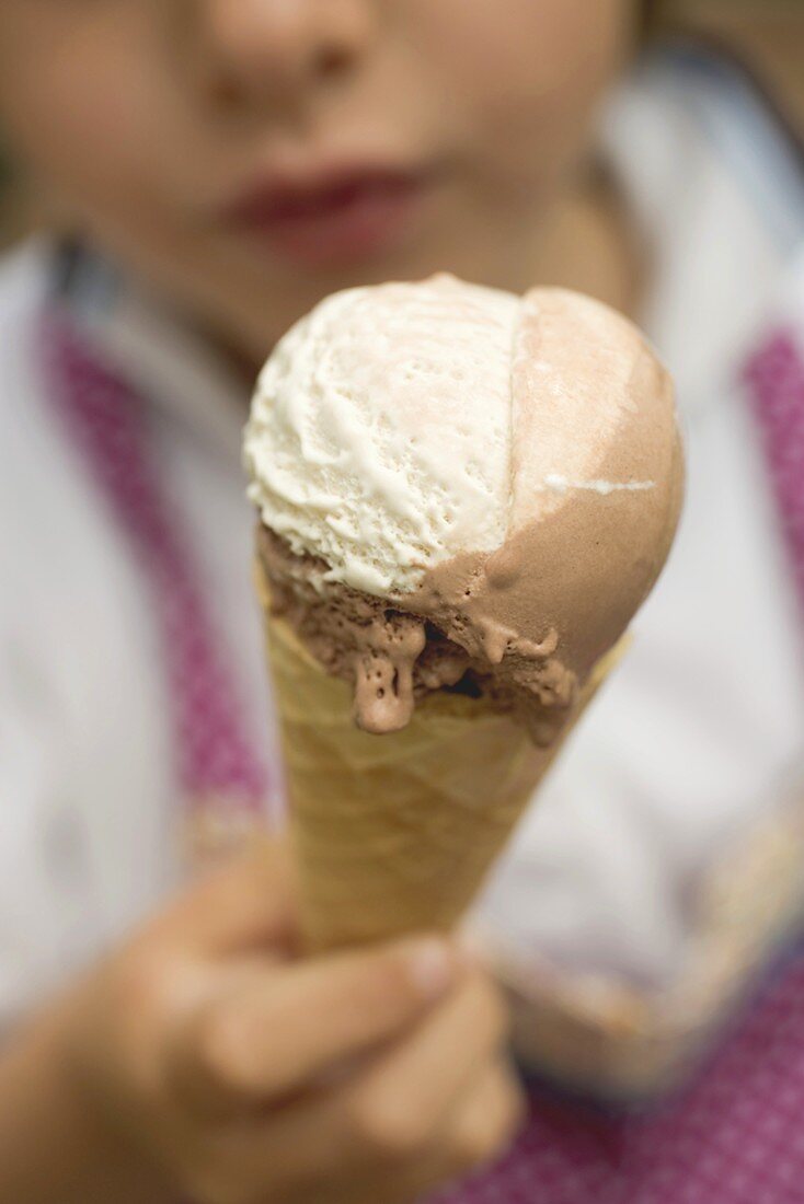 Child holding an ice cream cone
