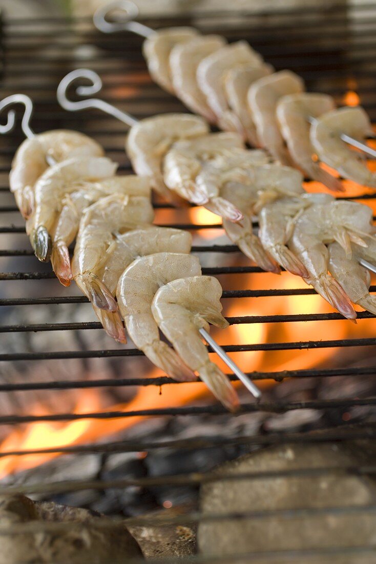 Prawn kebabs on barbecue grill rack