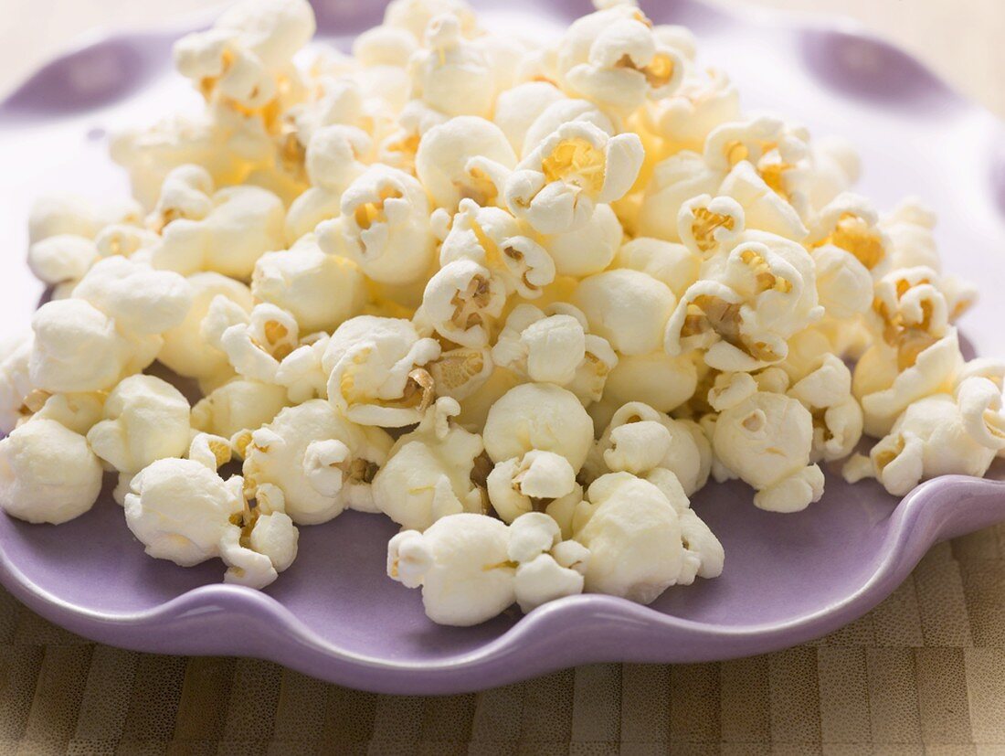 Popcorn on purple plate