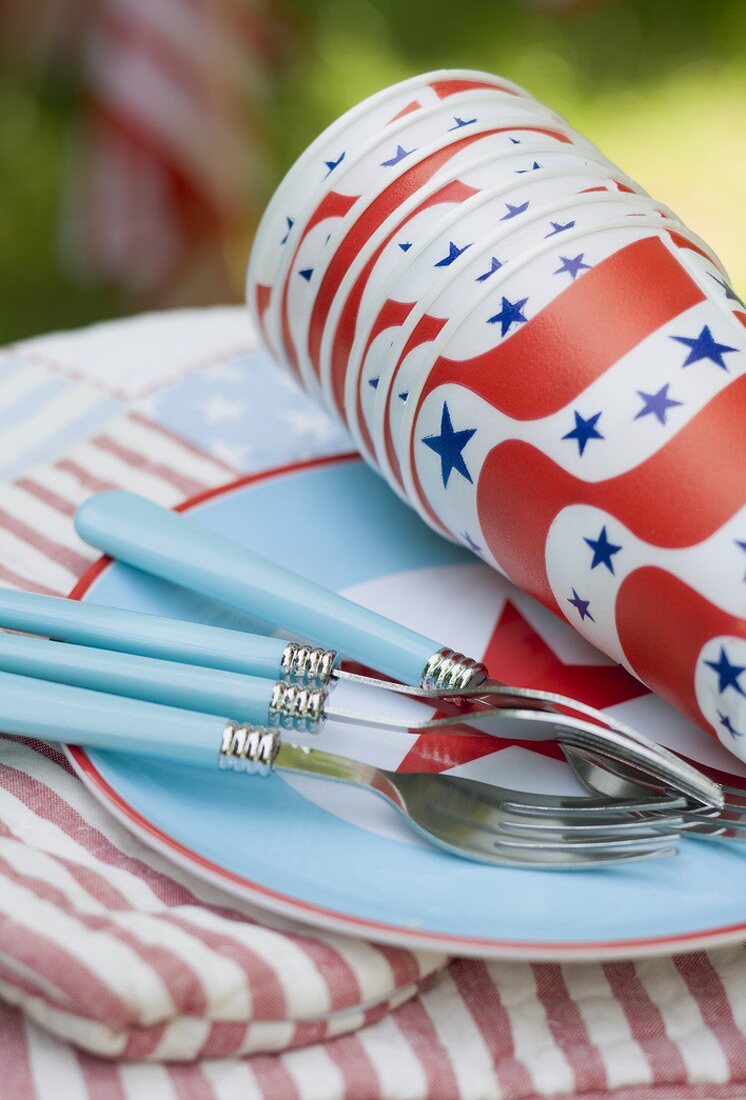 Paper cups and forks on a plate for the 4th of July (USA)