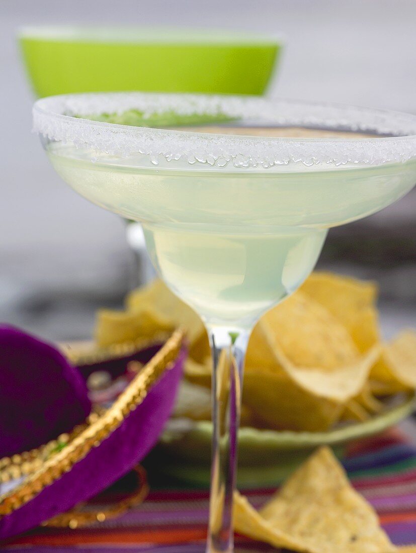 Margarita in glass with salted rim, tortilla chips (Mexico)