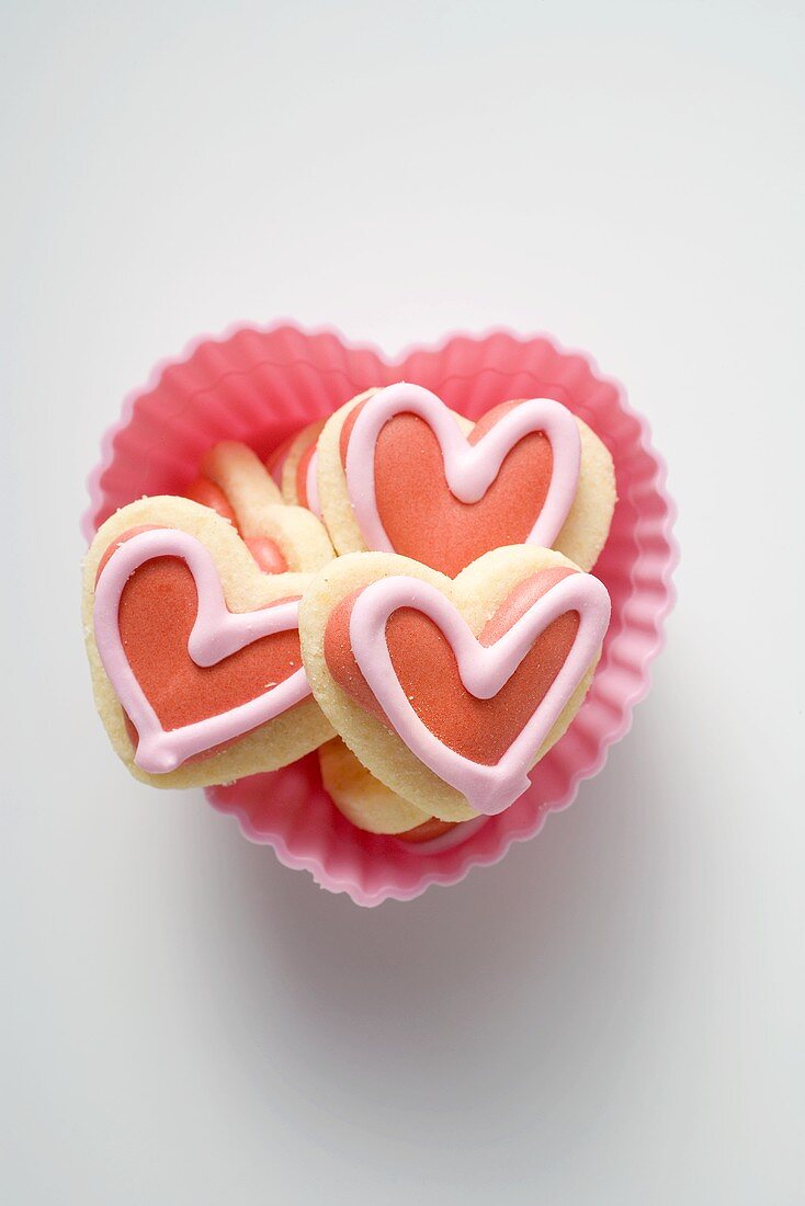 Several iced, heart-shaped biscuits