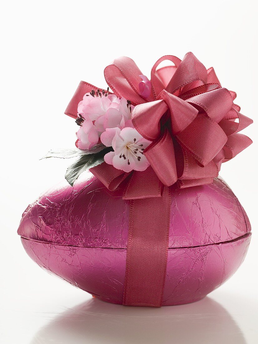 Pink chocolate Easter egg with bow