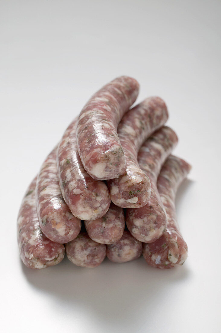 Raw sausages, in a pile