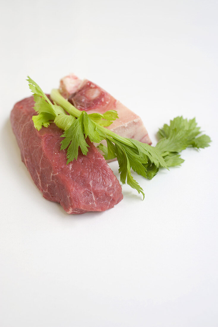 Piece of beef, bone and parsley