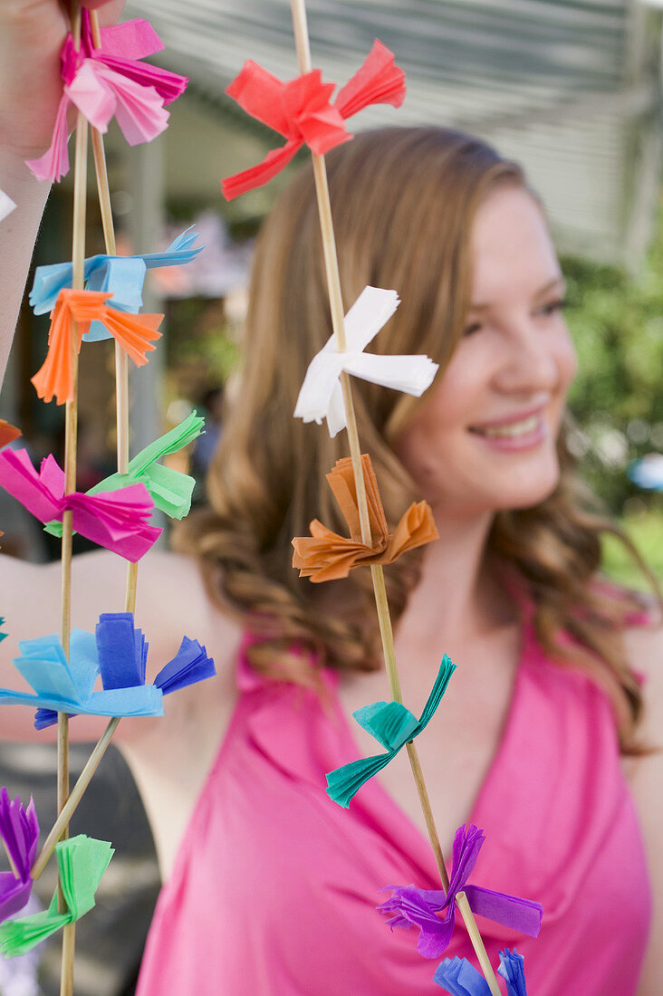 Woman with coloured garlands for garden party