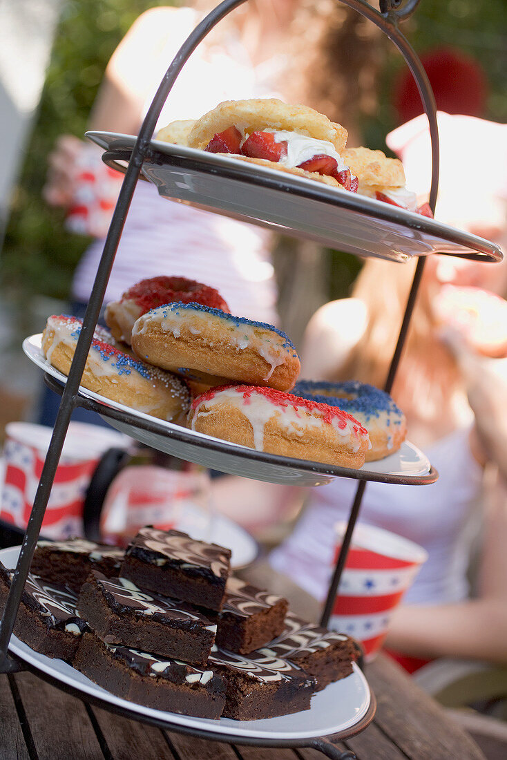 Brownies, doughnuts & strawberry shortcake on tiered stand