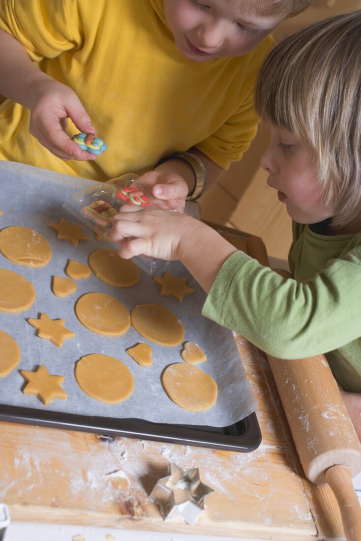 Children decorating biscuits