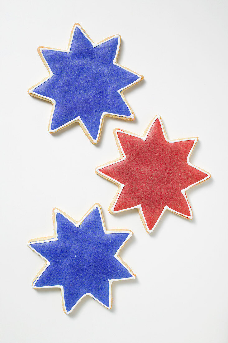 Three star cookies with red and blue icing
