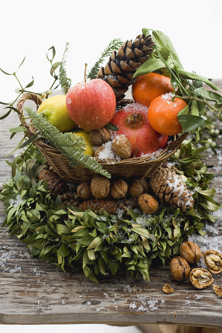 Christmas decoration: fruit, nuts, cones and box wreath