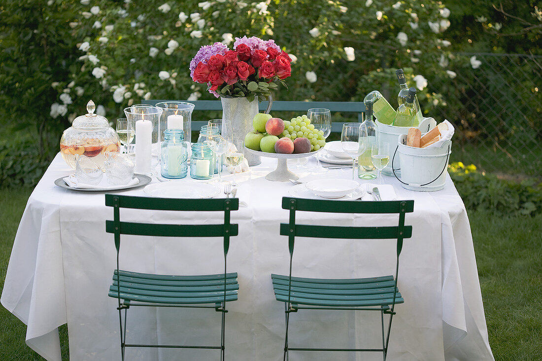 Table laid out of doors for a garden party