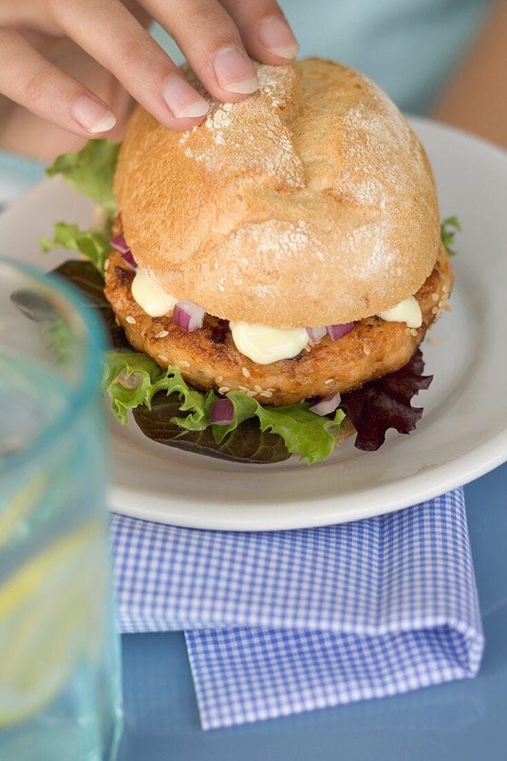 Woman holding burger