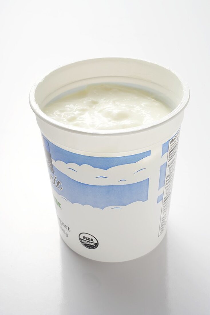 Natural yoghurt in yoghurt pot