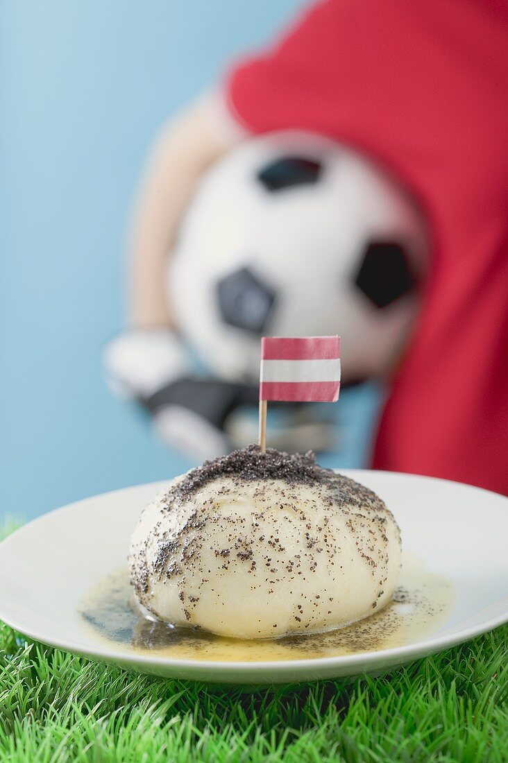 Yeast dumpling with flag, footballer in background