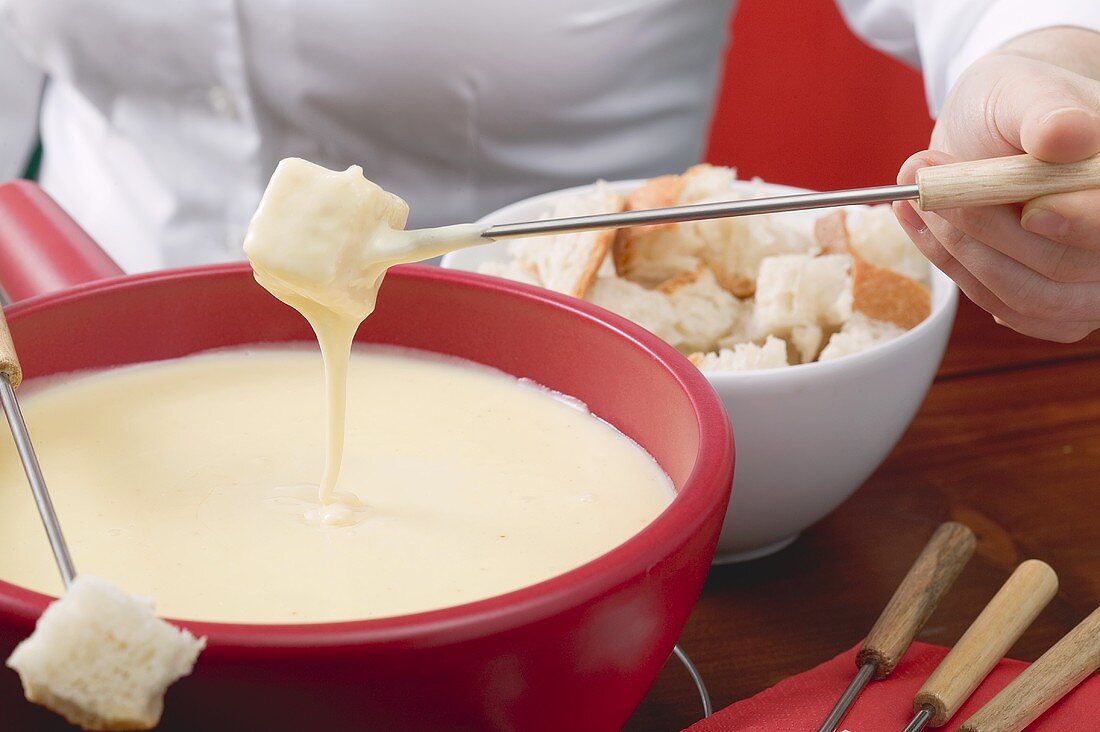 Woman eating cheese fondue