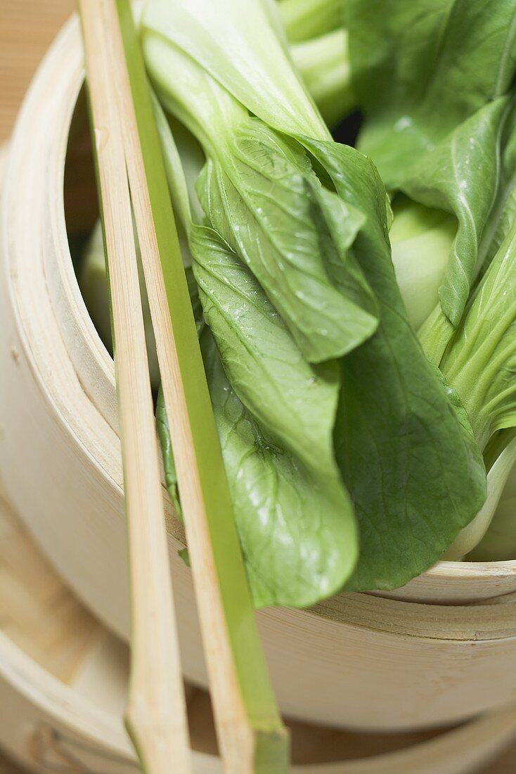 Pak choi in bamboo steamer (overhead view)