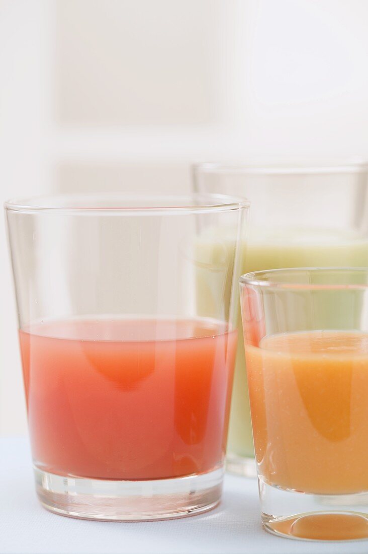 Three different juices in glasses