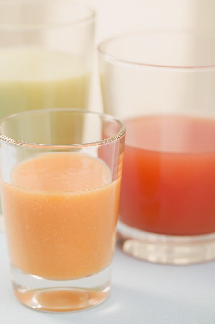 Three different juices in glasses