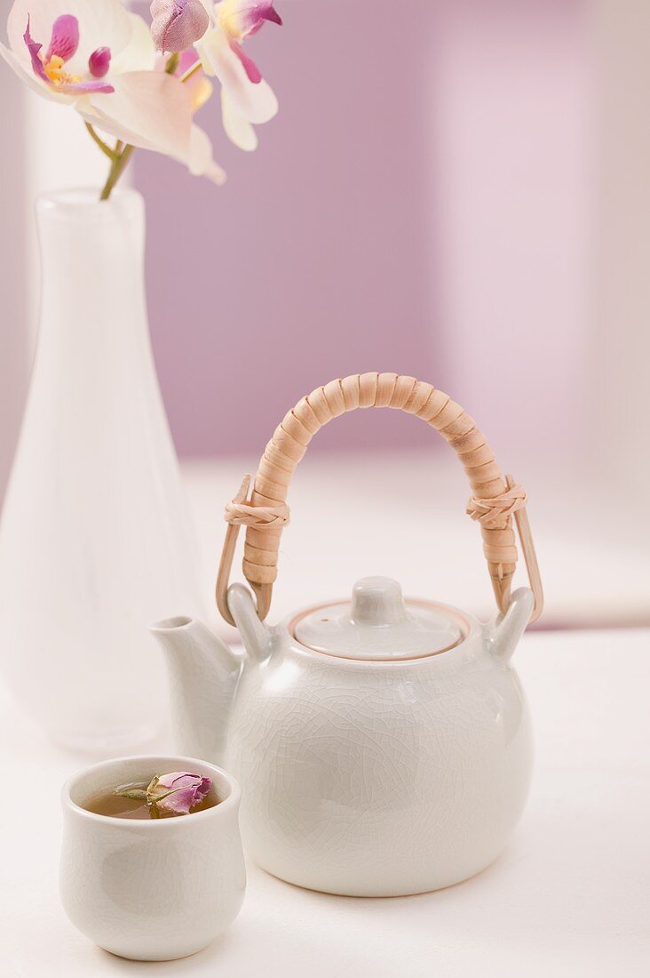 Rose tea in pot and tea bowl