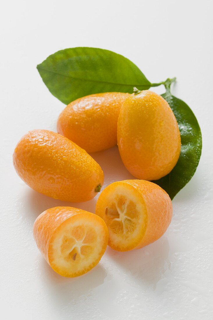 Several kumquats with leaves