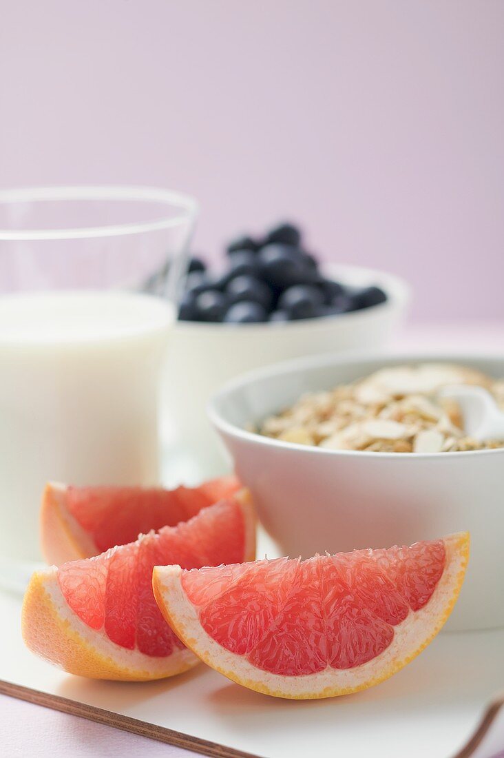Muesli ingredients: cereal, yoghurt, blueberries, grapefruit
