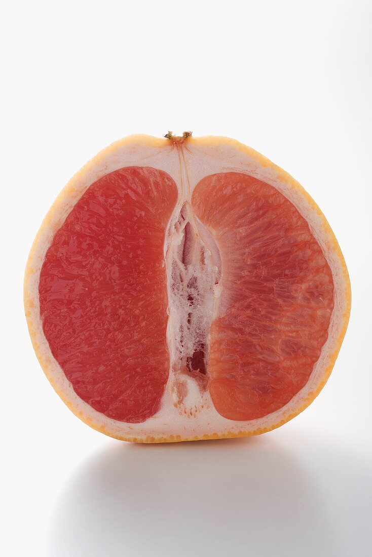Half a pink grapefruit (longitudinal section)