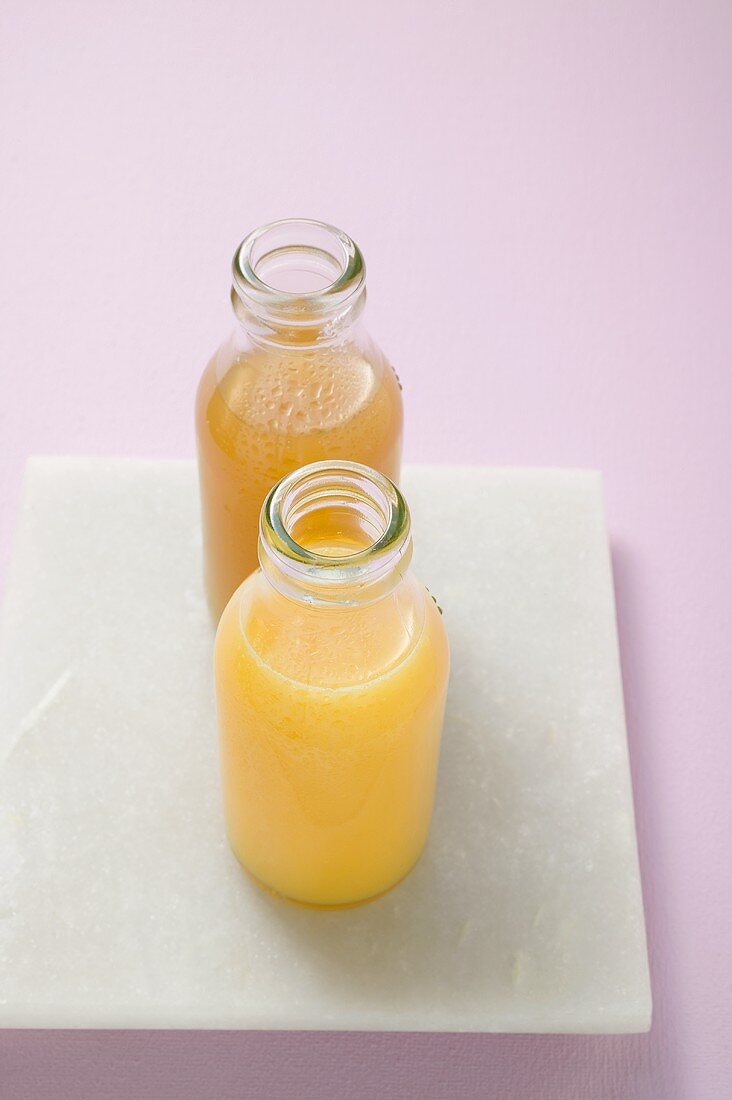 Two fruit juices in bottles