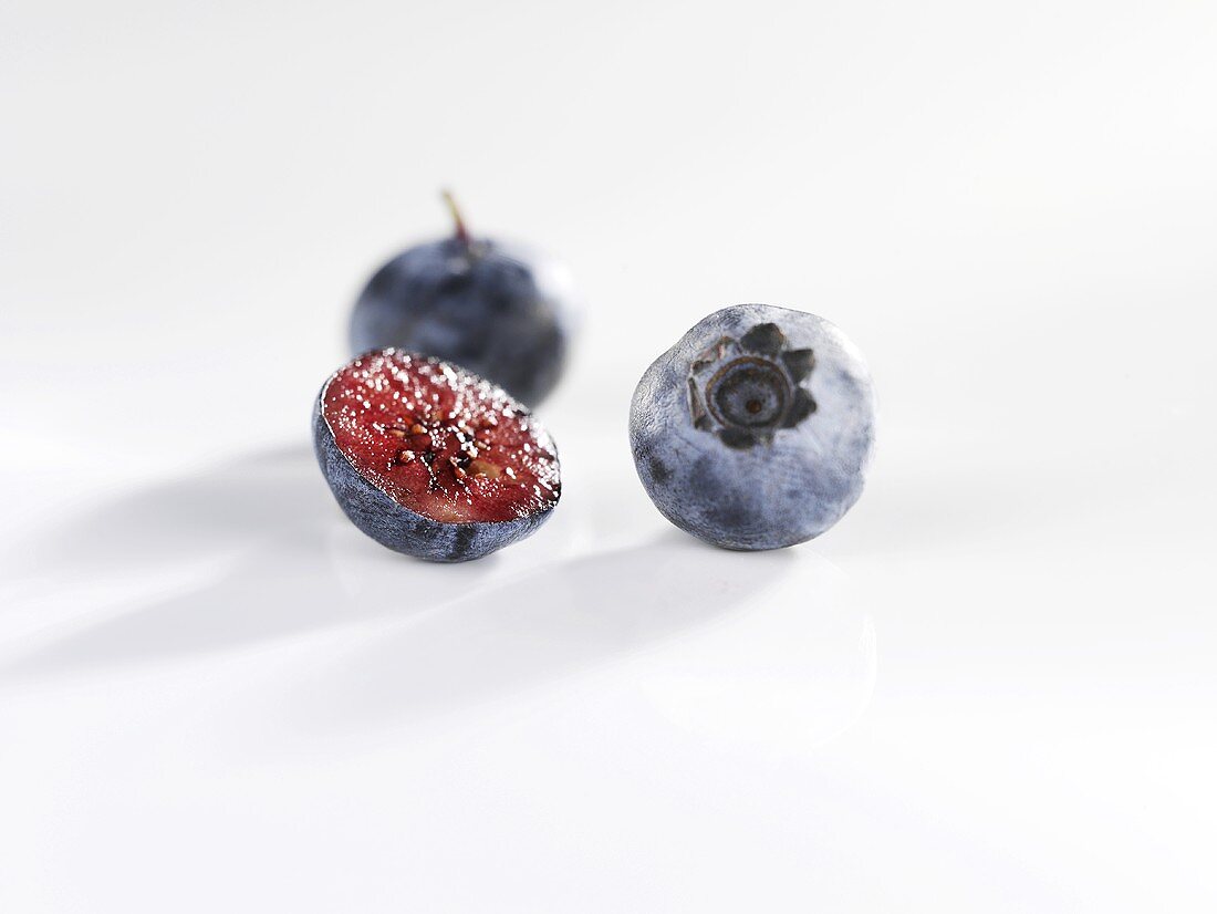 Blueberries, one halved