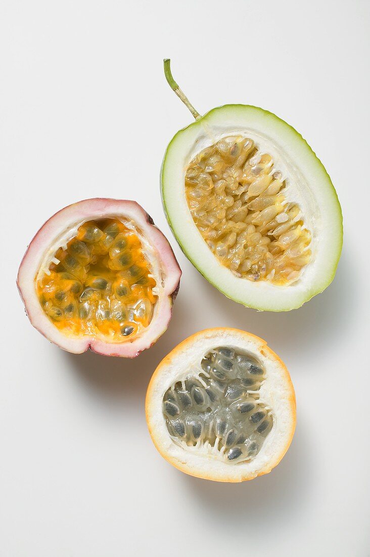 Various types of passion fruit, halved