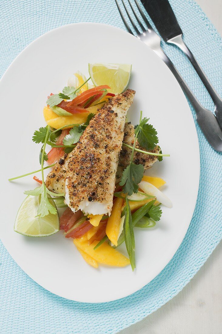 Spicy pangasius fillet with vegetables, lime, coriander