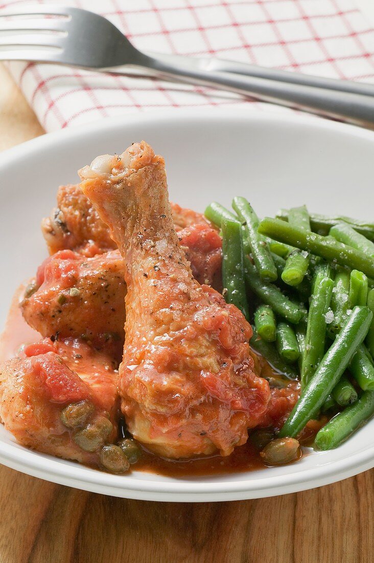 Chicken with tomato sauce, capers and green beans