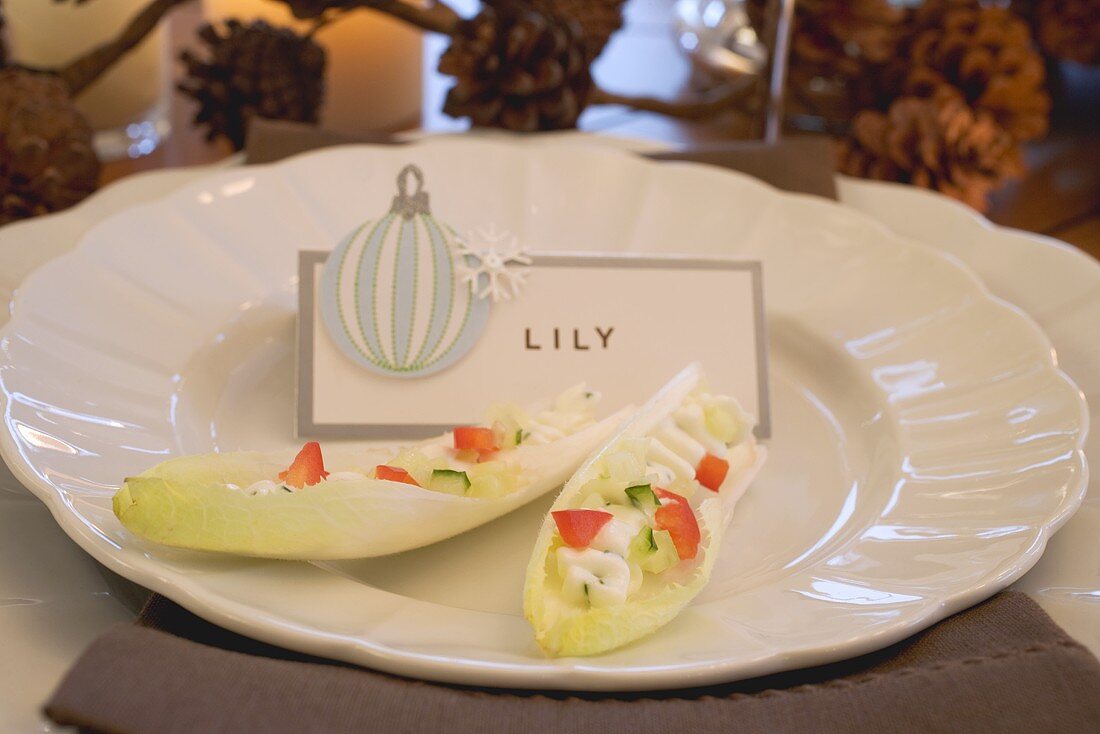 Christmas place-setting with filled chicory boats