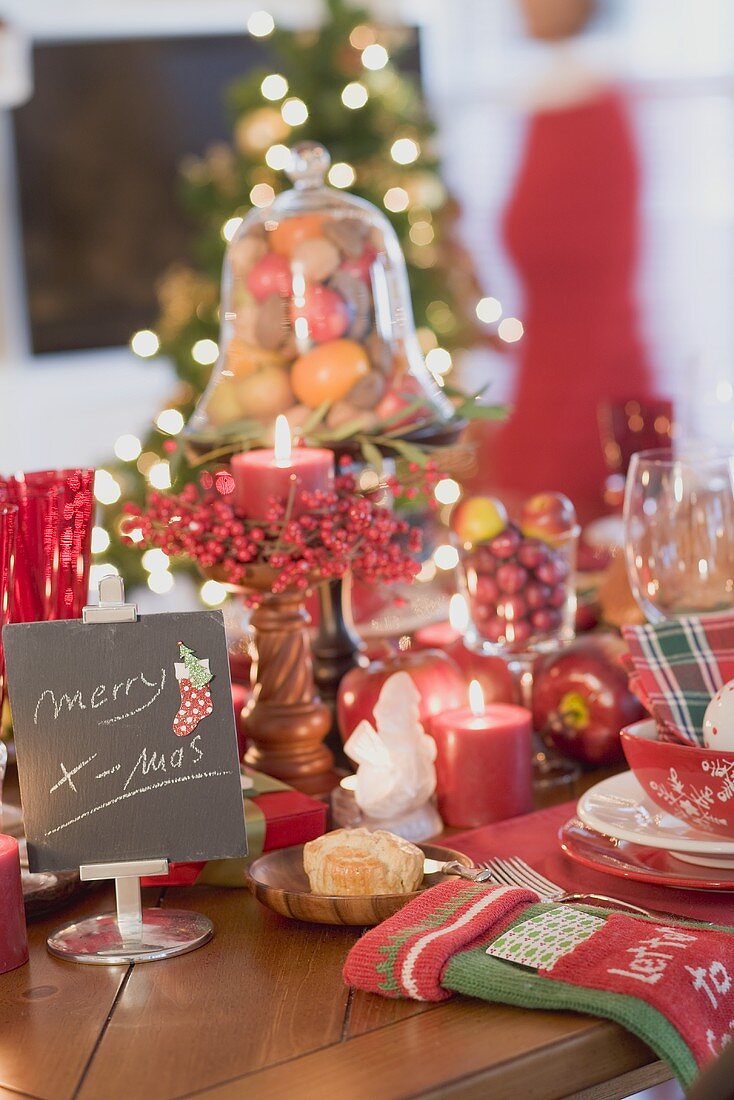 Christmas table, woman in background (USA)