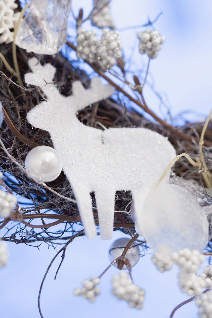 White reindeer on Christmas wreath (close-up)